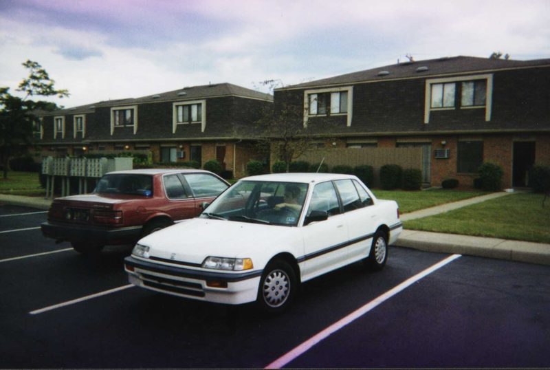 A car parked in a suburban parking lot — the world of Walter Lawrence's songs